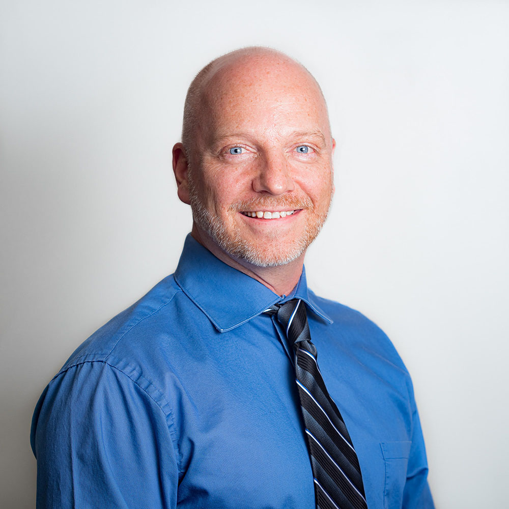 Professional headshot of FuzeHub's Eric Fasser