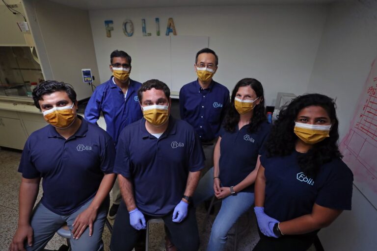 Folia Materials employees in the office posing for a picture