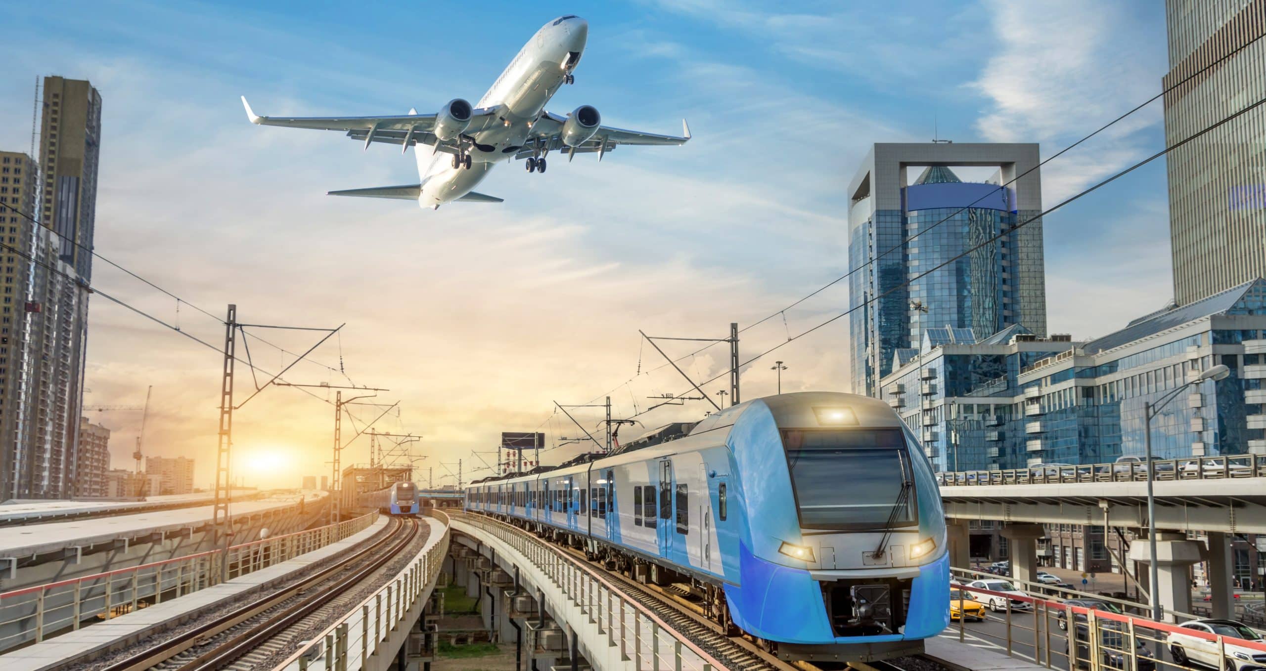 Urban view of railway tracks and suburban electric trains rushing along among high rise buildings. Passenger plane flying in sky, landing at airport. Concept of modern infrastructure transport travel.